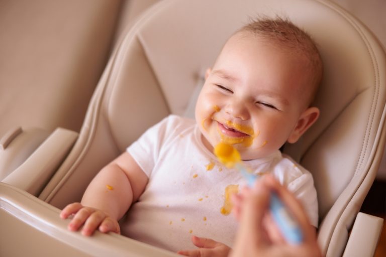 Baby eating solid food