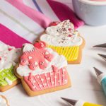 Colorful,icing,cookies,in,cupcake,shape,on,white,background,and
